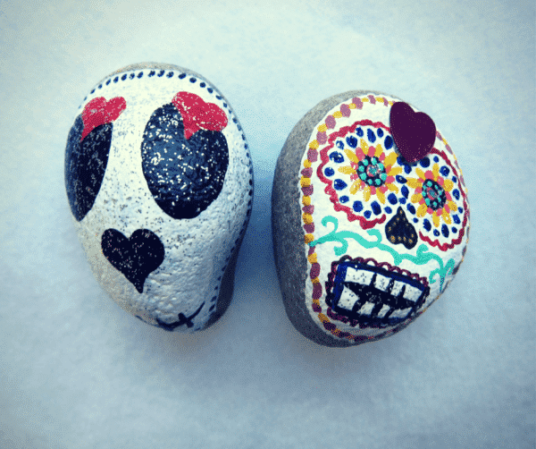 stone painted day of the dead skulls